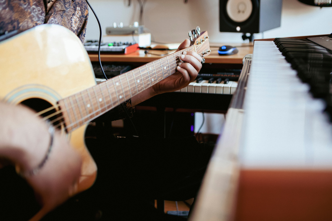 Man Playing Guitar in Recording Studio